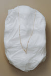 Dainty gold crescent moon necklace with sparkling moissanite stations