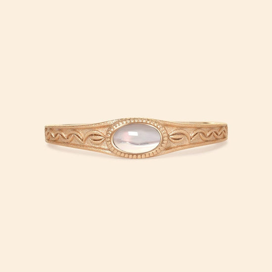 Vintage-style 14k gold plated ring with intricate wave scroll engravings and an oval opal cabochon, handcrafted ancient relic jewelry by LIRAE.
