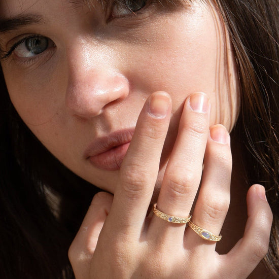 Vintage-style 14k gold plated ring with intricate wave scroll engravings and an oval opal cabochon, handcrafted ancient relic jewelry by LIRAE.