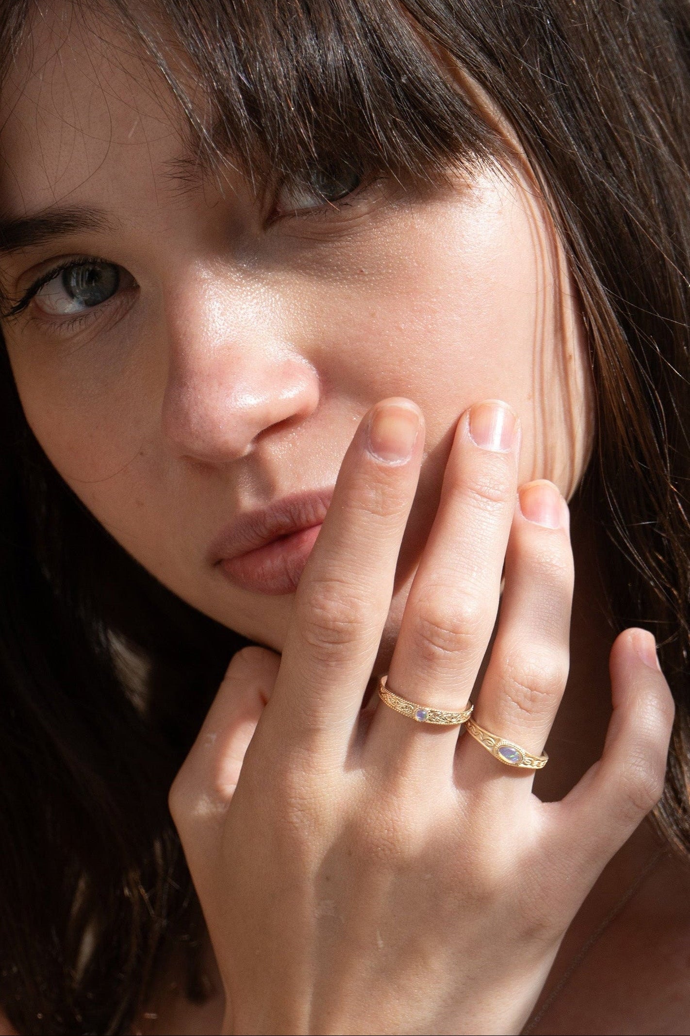 Vintage-style 14k gold plated ring with intricate wave scroll engravings and an oval opal cabochon, handcrafted ancient relic jewelry by LIRAE.