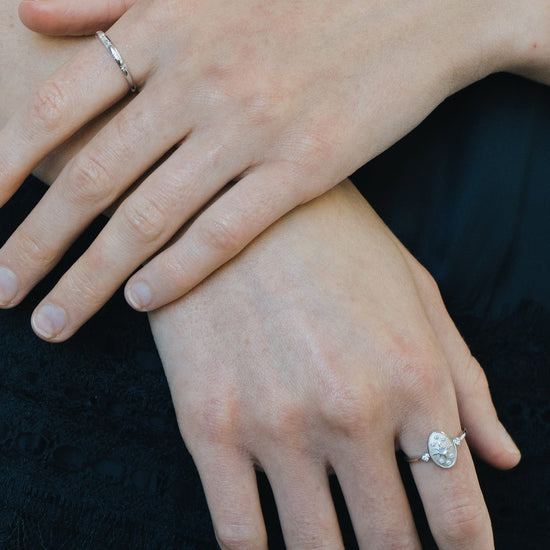 Dainty silver celestial compass ring with oval starburst design and sparkling accents