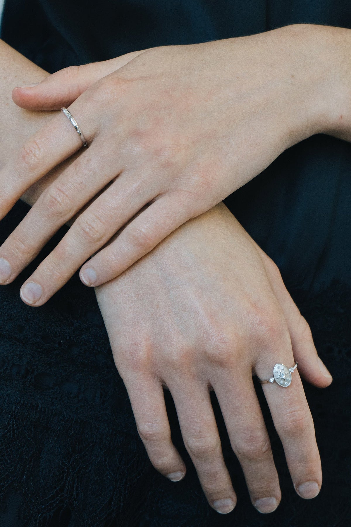 Dainty silver celestial compass ring with oval starburst design and sparkling accents