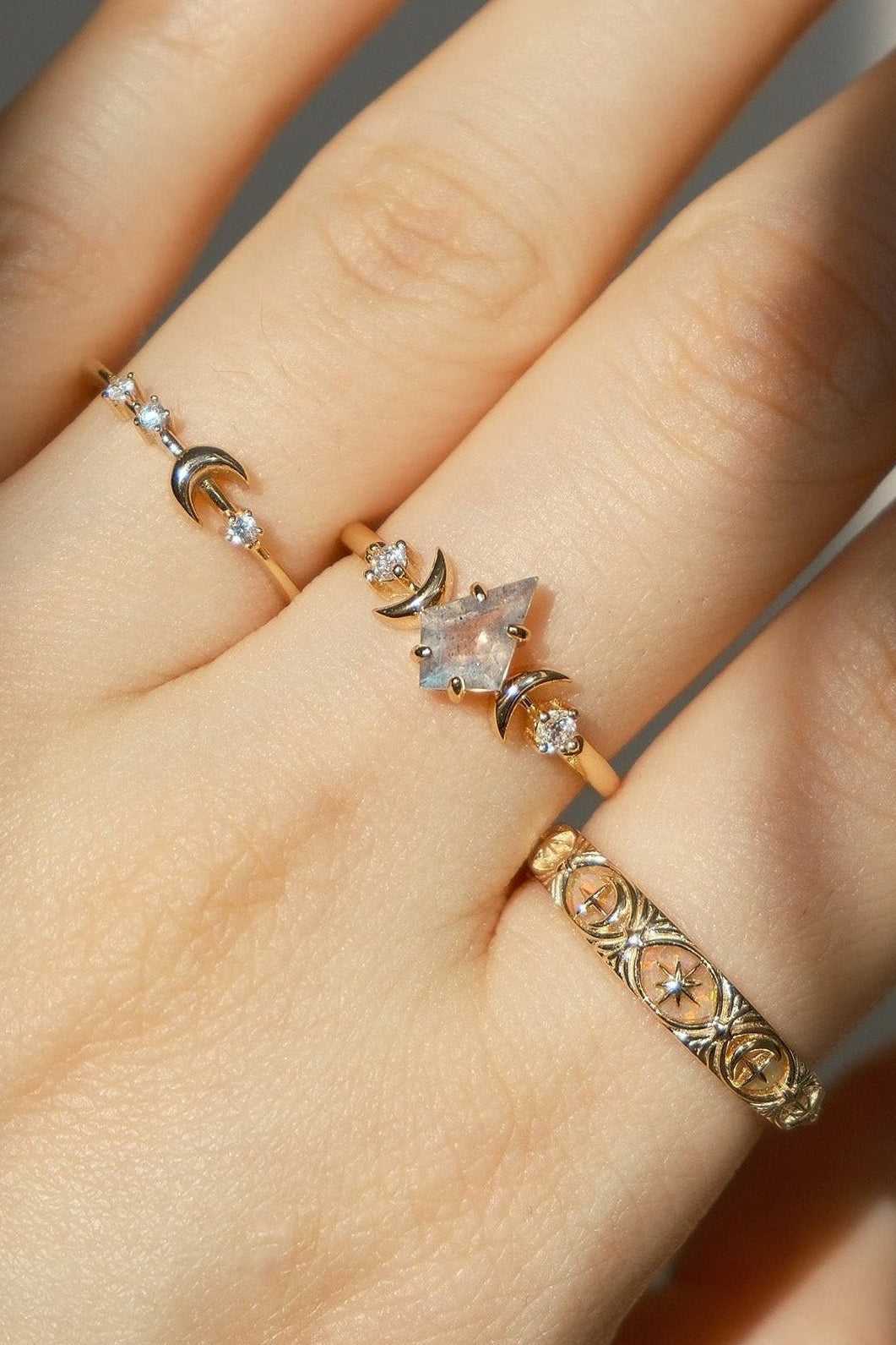 Hand-made 14k gold star band with Crescent Moon and North Star motifs, celestial-inspired wedding or stacking ring by LIRAE.
