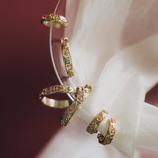 Hand-made 14k gold star band with Crescent Moon and North Star motifs, celestial-inspired wedding or stacking ring by LIRAE.