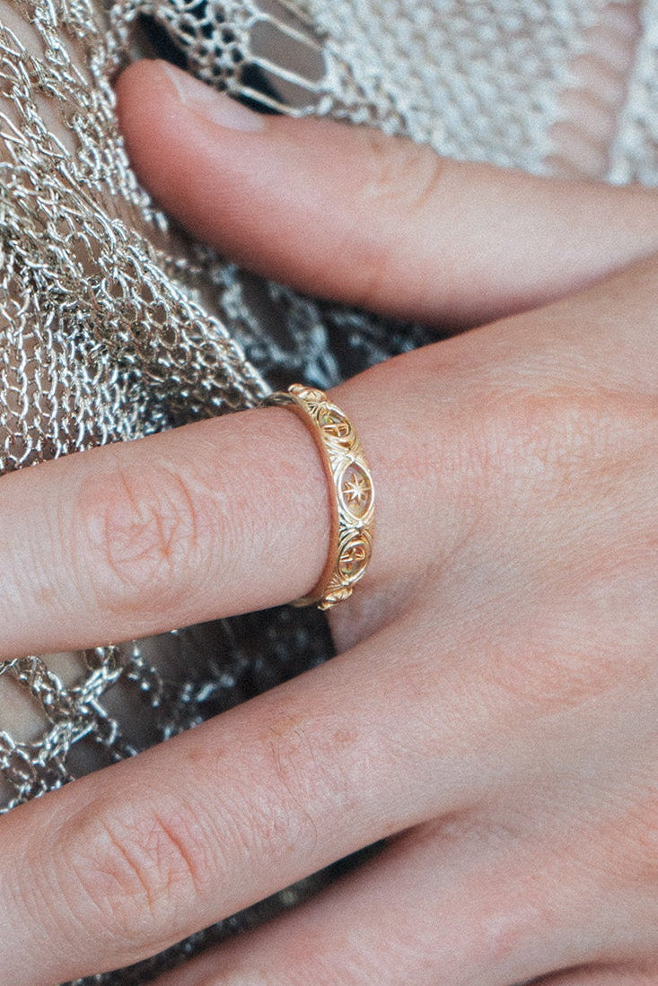 Hand-made 14k gold star band with Crescent Moon and North Star motifs, celestial-inspired wedding or stacking ring by LIRAE.