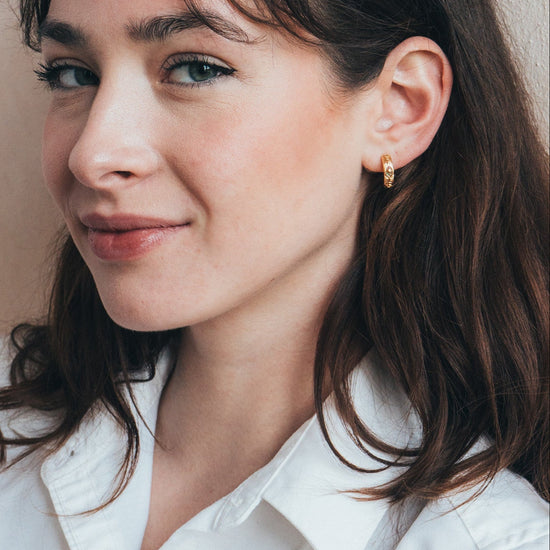 Hand-made gold star hoop earrings with Crescent Moon and North Star motifs, celestial-inspired earrings by LIRAE.
