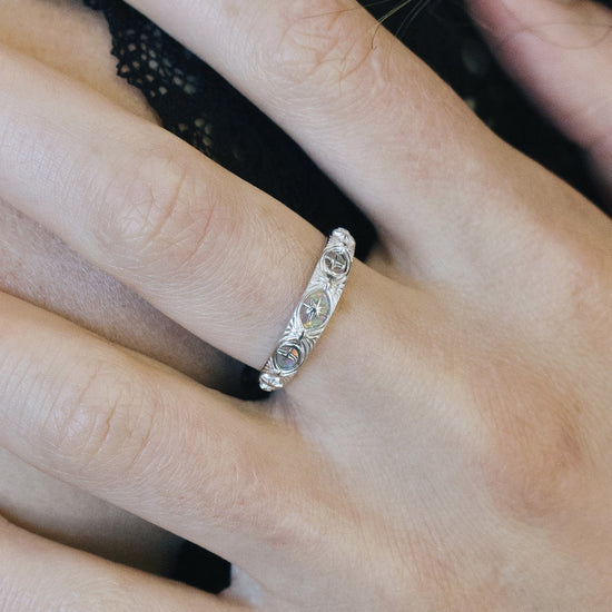 Hand-made silver star band with Crescent Moon and North Star motifs, celestial-inspired wedding or stacking ring by LIRAE.