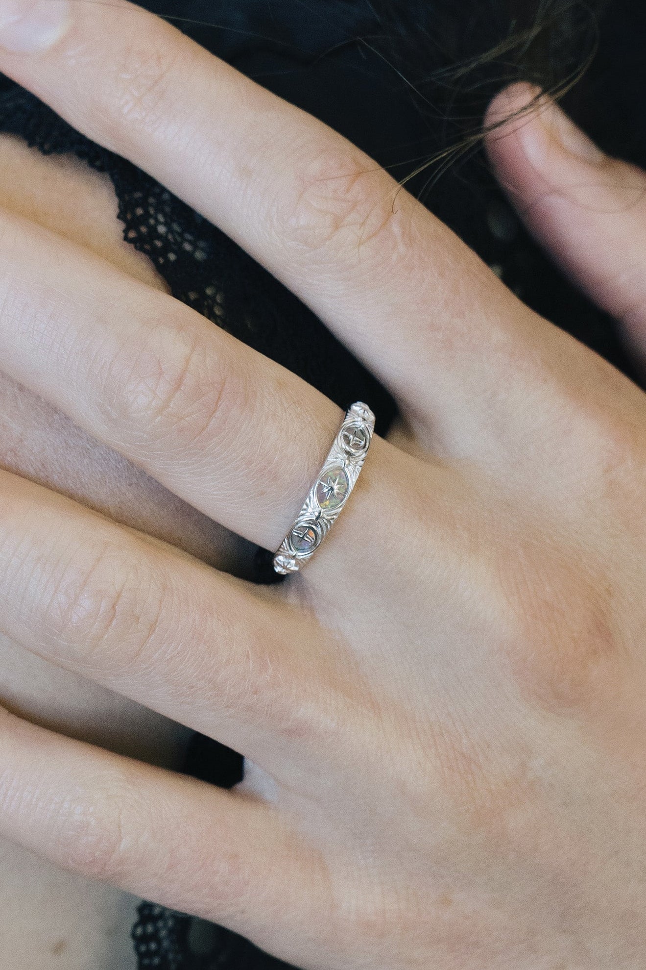 Hand-made silver star band with Crescent Moon and North Star motifs, celestial-inspired wedding or stacking ring by LIRAE.