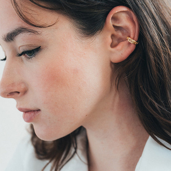Hand-made gold star ear cuff with crescent moon and north star motifs, celestial-inspired ear cuff by LIRAE.
