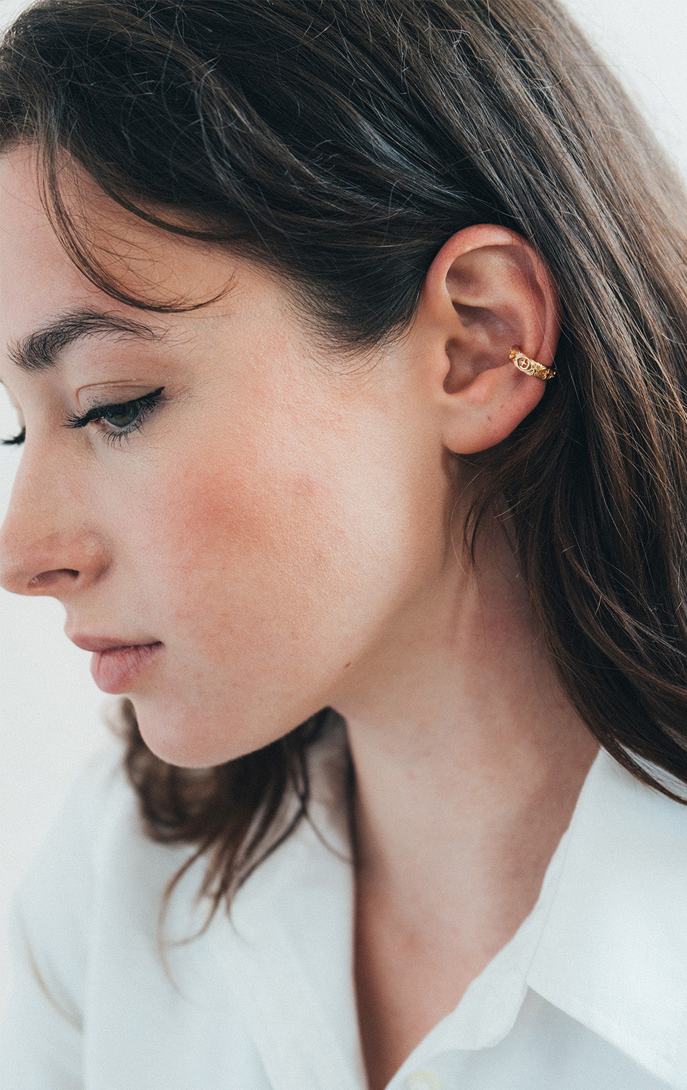 Hand-made gold star ear cuff with crescent moon and north star motifs, celestial-inspired ear cuff by LIRAE.
