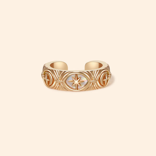 Hand-made gold star ear cuff with crescent moon and north star motifs, celestial-inspired ear cuff by LIRAE.