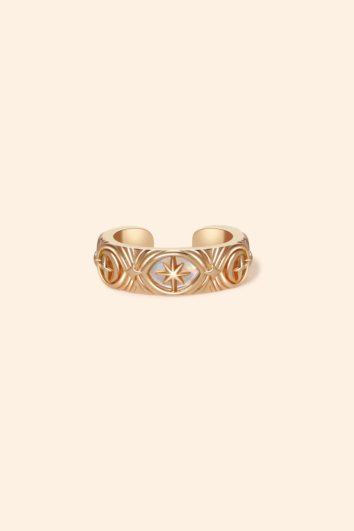 Hand-made gold star ear cuff with crescent moon and north star motifs, celestial-inspired ear cuff by LIRAE.