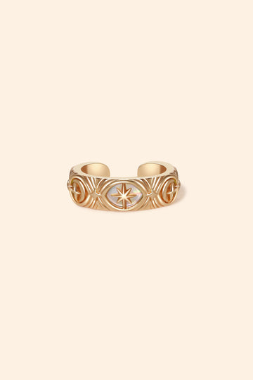 Hand-made gold star ear cuff with crescent moon and north star motifs, celestial-inspired ear cuff by LIRAE.