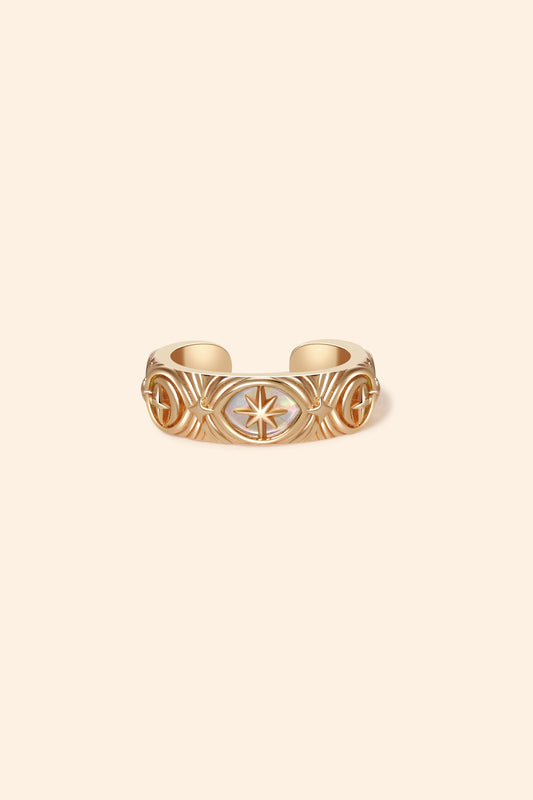 Hand-made gold star ear cuff with crescent moon and north star motifs, celestial-inspired ear cuff by LIRAE.