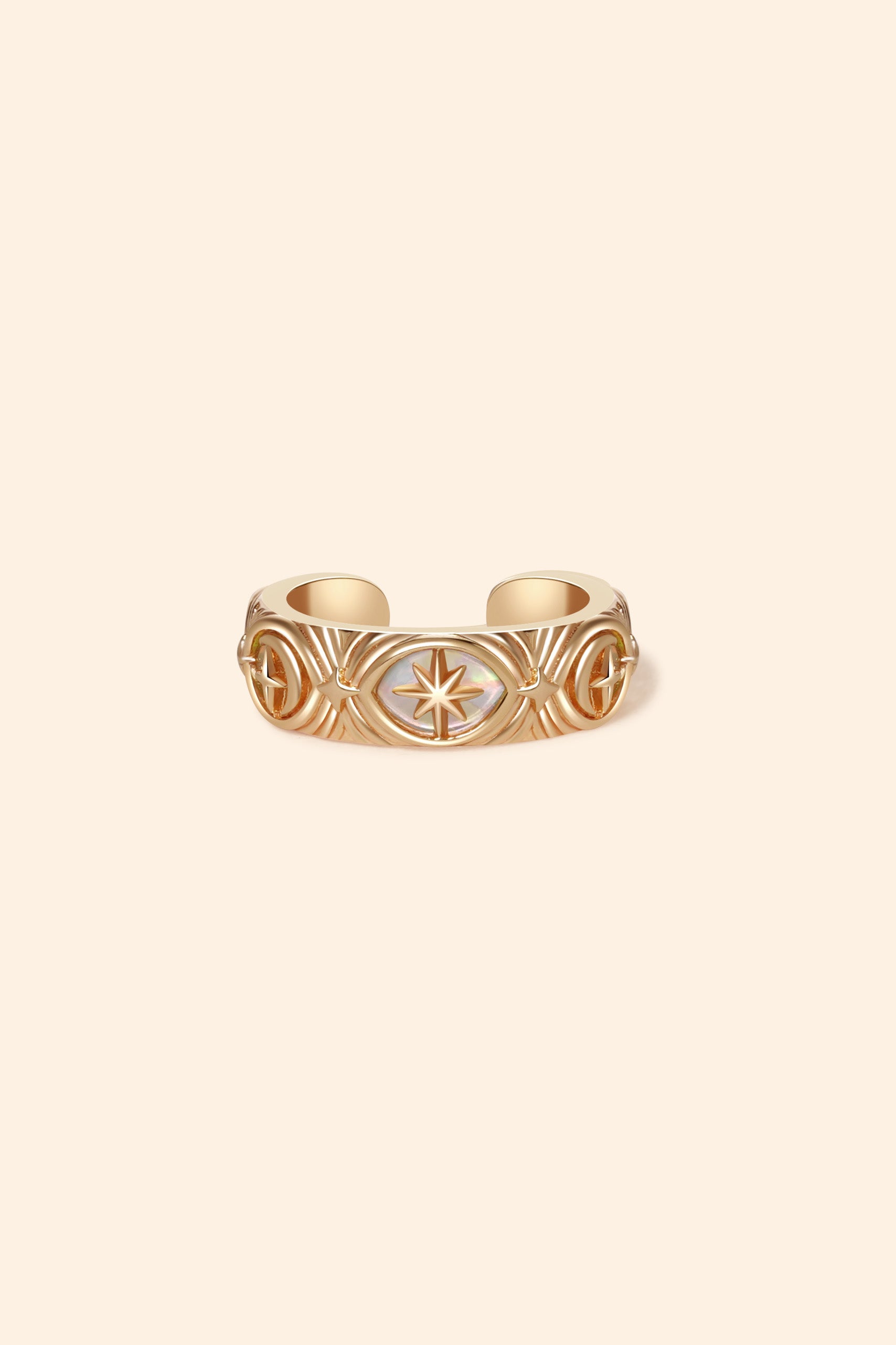 Hand-made gold star ear cuff with crescent moon and north star motifs, celestial-inspired ear cuff by LIRAE.