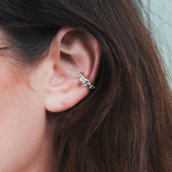 Hand-made silver star ear cuff with crescent moon and north star motifs, celestial-inspired ear cuff by LIRAE.