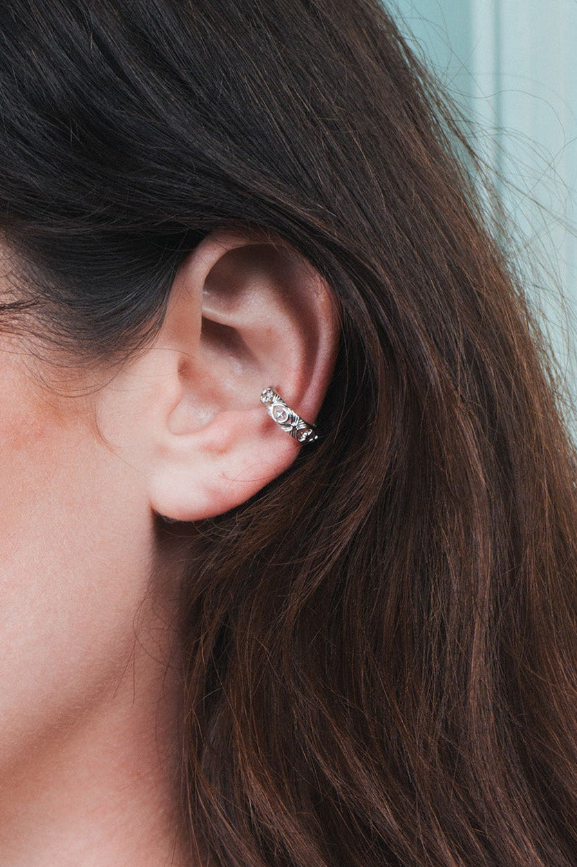 Hand-made silver star ear cuff with crescent moon and north star motifs, celestial-inspired ear cuff by LIRAE.
