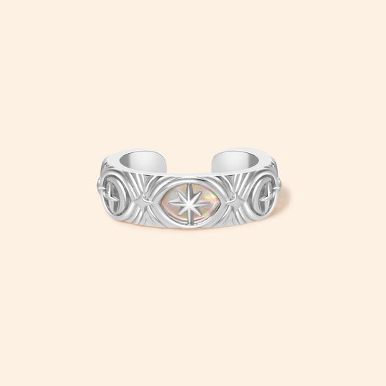 Hand-made silver star ear cuff with crescent moon and north star motifs, celestial-inspired ear cuff by LIRAE.