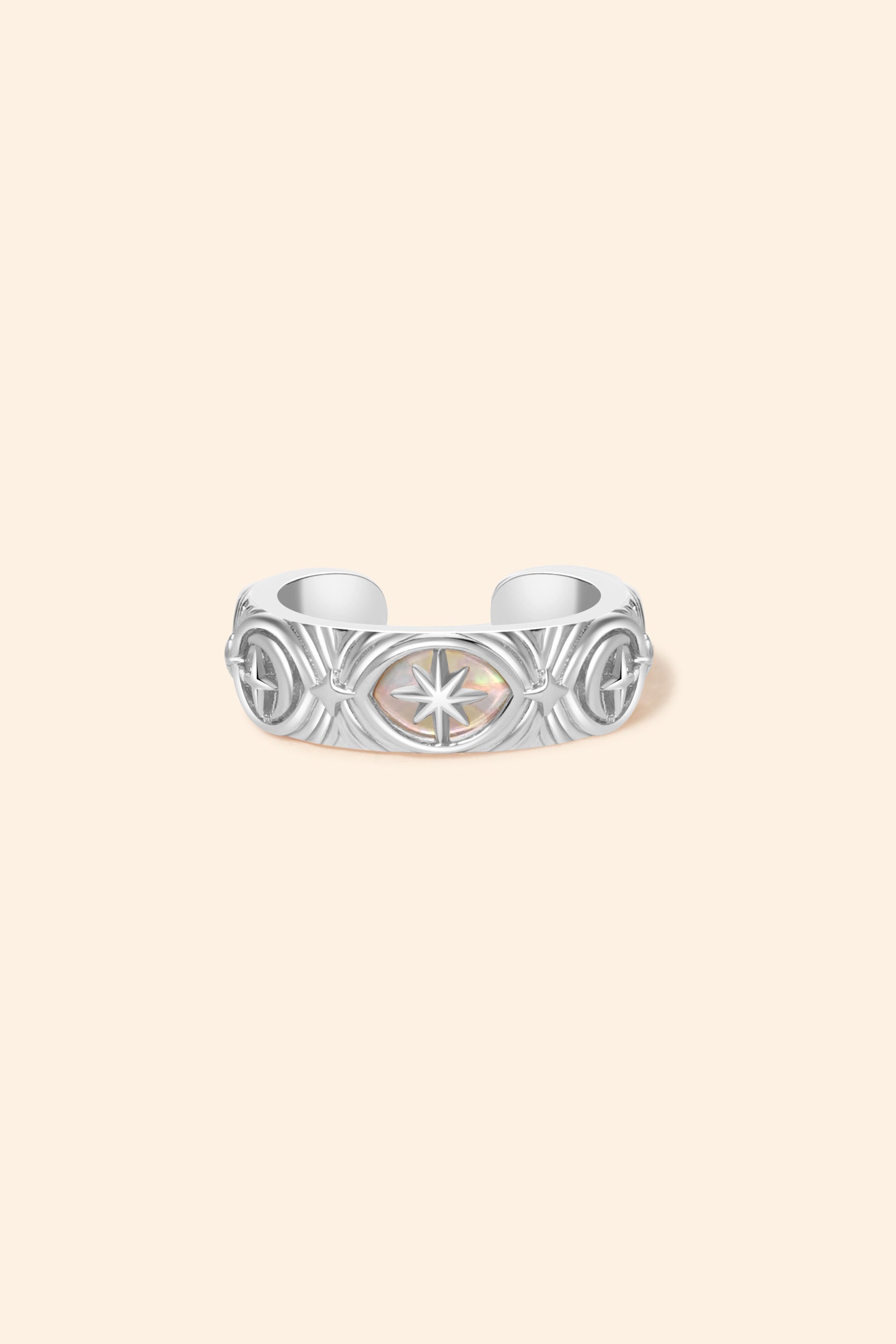 Hand-made silver star ear cuff with crescent moon and north star motifs, celestial-inspired ear cuff by LIRAE.