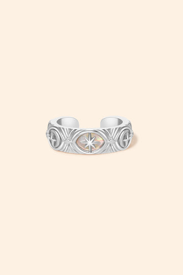 Hand-made silver star ear cuff with crescent moon and north star motifs, celestial-inspired ear cuff by LIRAE.