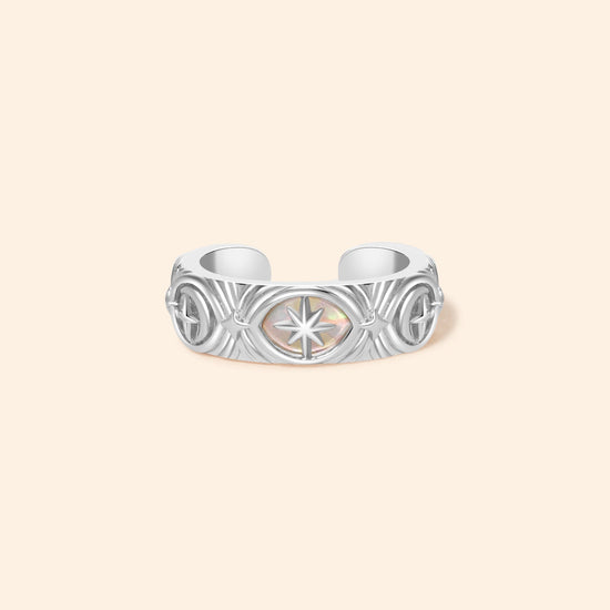Hand-made silver star ear cuff with crescent moon and north star motifs, celestial-inspired ear cuff by LIRAE.