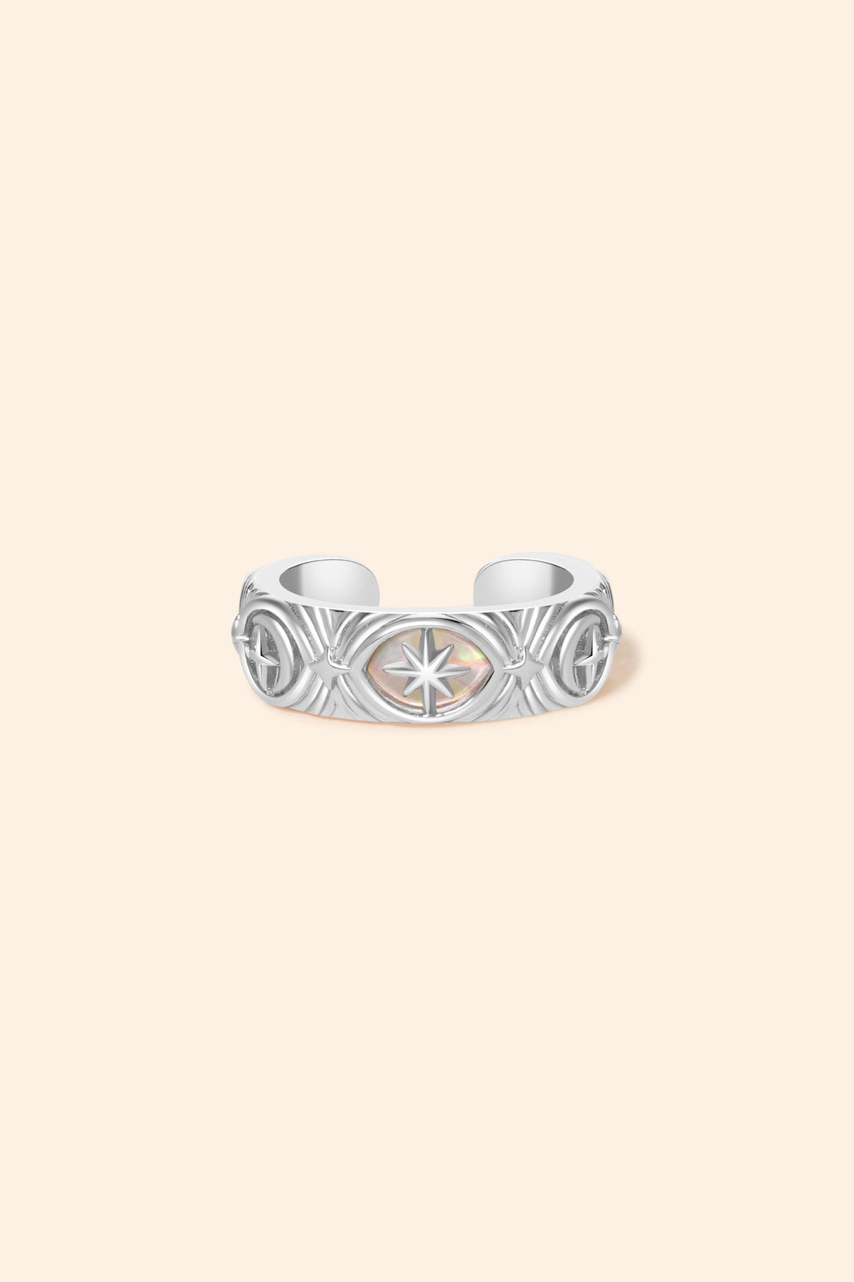 Hand-made silver star ear cuff with crescent moon and north star motifs, celestial-inspired ear cuff by LIRAE.