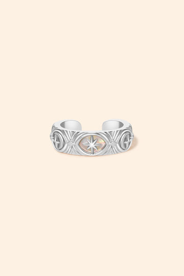Hand-made silver star ear cuff with crescent moon and north star motifs, celestial-inspired ear cuff by LIRAE.