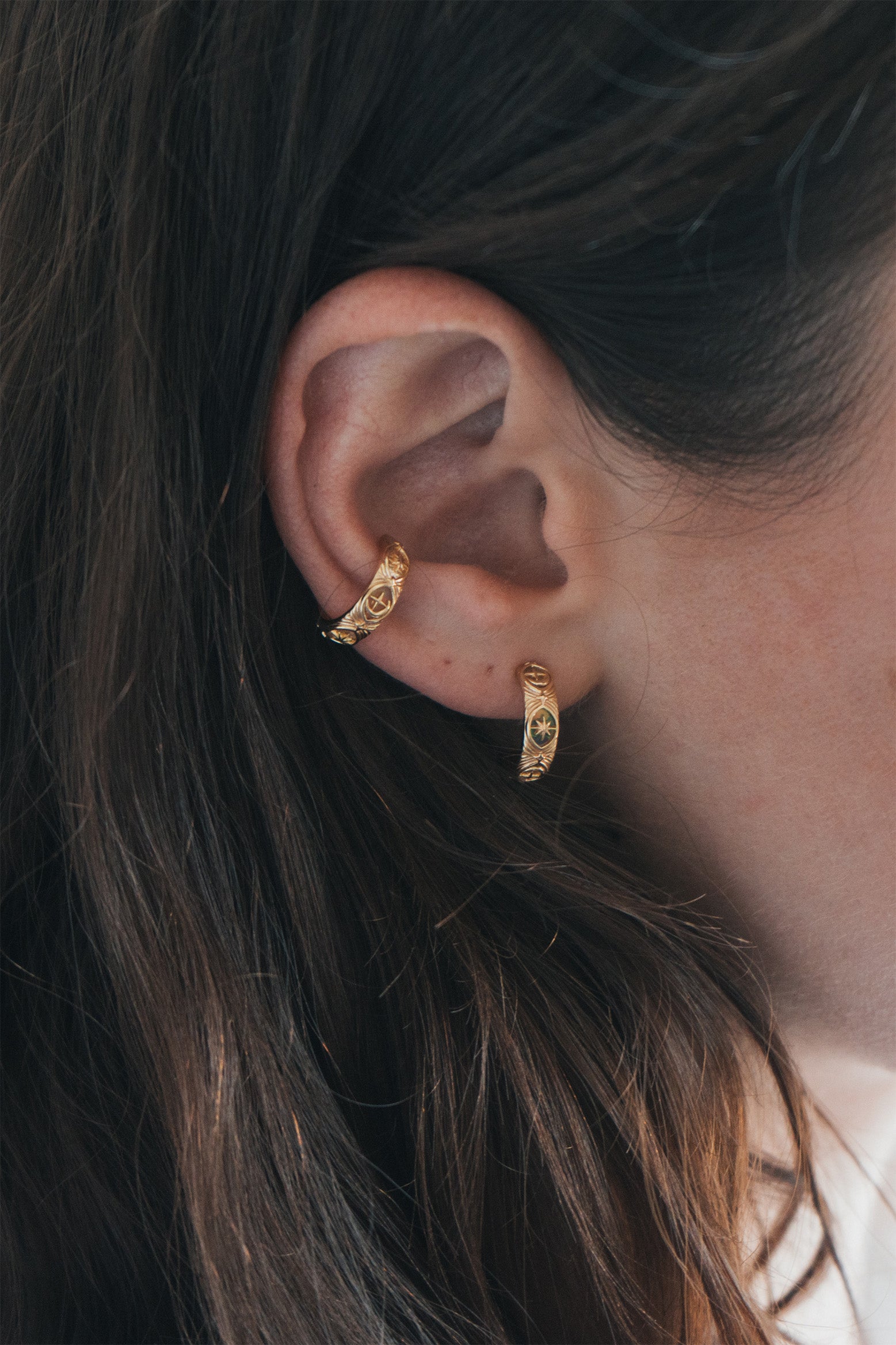 Hand-made gold star hoop earrings with Crescent Moon and North Star motifs, celestial-inspired earrings by LIRAE.