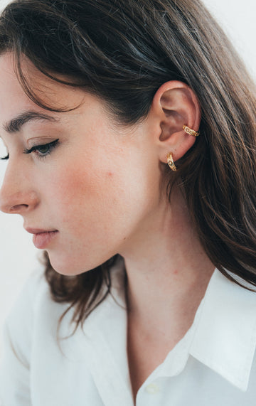 Hand-made gold star hoop earrings with Crescent Moon and North Star motifs, celestial-inspired earrings by LIRAE.