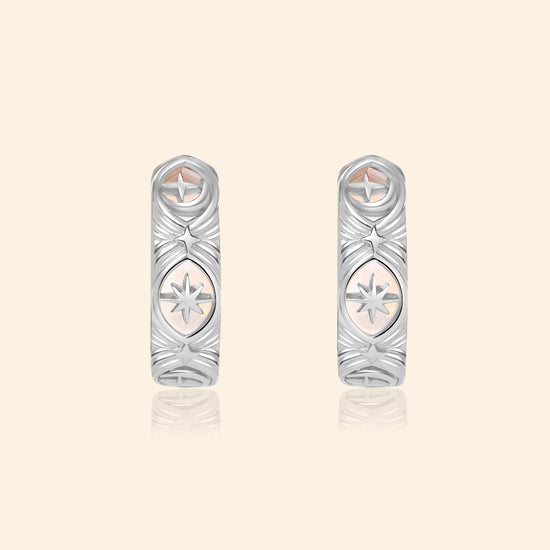 Silver solstice hoop earrings featuring fire opals and celestial starburst engravings by LIRAE.