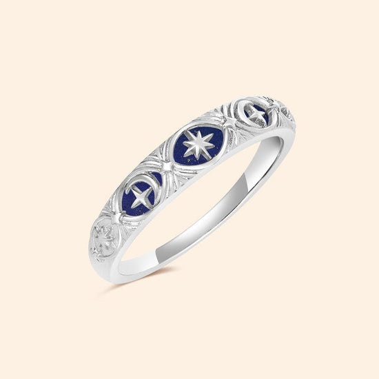 Silver celestial star ring with deep blue lapis lazuli inlay and engraved sun moon details