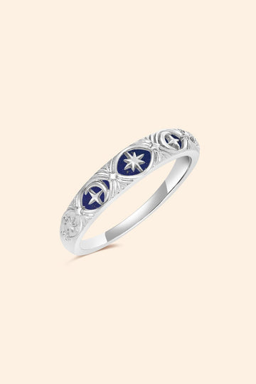 Silver celestial star ring with deep blue lapis lazuli inlay and engraved sun moon details