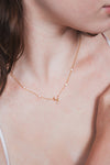 Dainty gold crescent moon necklace with sparkling moissanite stations