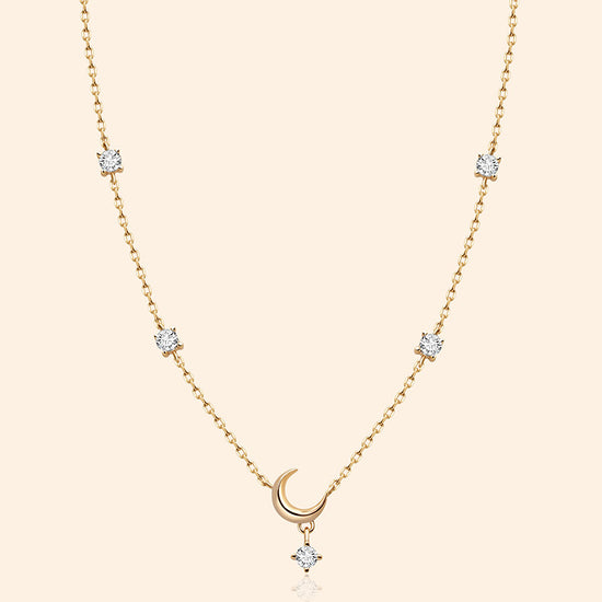 Dainty gold crescent moon necklace with sparkling moissanite stations