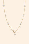 Dainty gold crescent moon necklace with sparkling moissanite stations