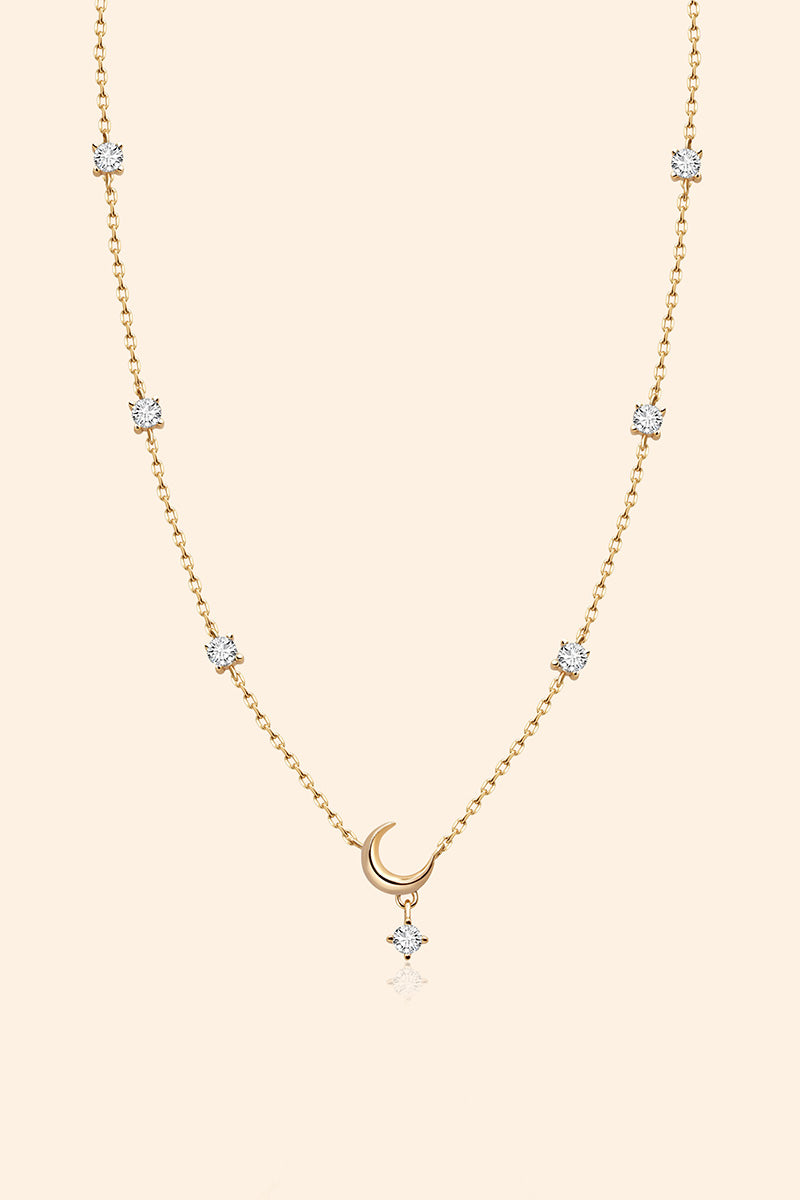 Dainty gold crescent moon necklace with sparkling moissanite stations