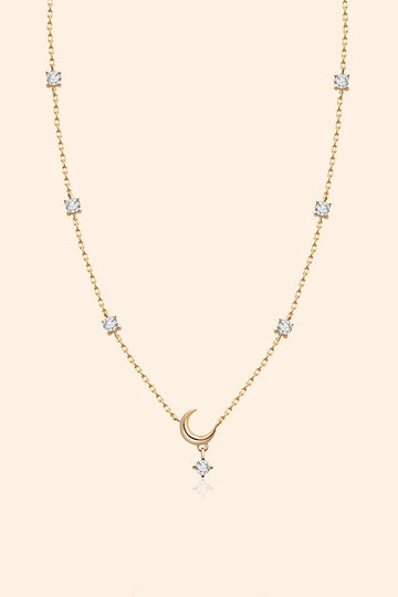 Dainty gold crescent moon necklace with sparkling moissanite stations