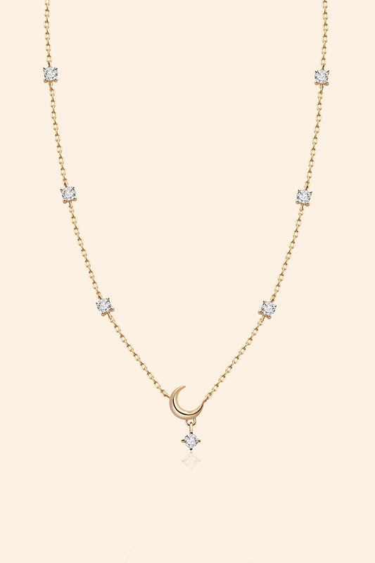 Dainty gold crescent moon necklace with sparkling moissanite stations