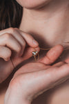 Gold heart arrow necklace with removable arrow and sparkling center moissanite stone