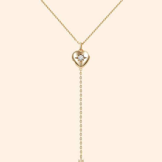 Gold heart arrow necklace with removable arrow and sparkling center moissanite stone