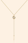 Gold heart arrow necklace with removable arrow and sparkling center moissanite stone