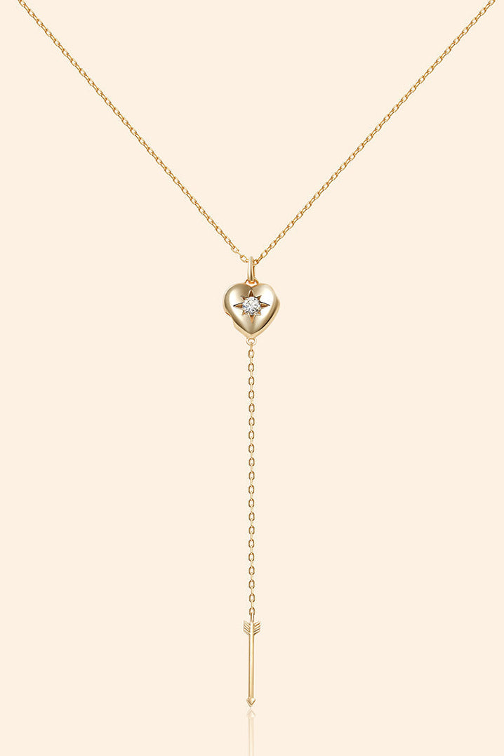 Gold heart arrow necklace with removable arrow and sparkling center moissanite stone