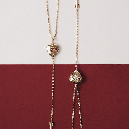 Gold heart arrow necklace with removable arrow and sparkling center moissanite stone