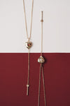 Gold heart arrow necklace with removable arrow and sparkling center moissanite stone