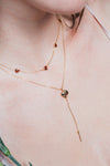 Gold heart charm necklace with removable arrow and red heart garnet center stone