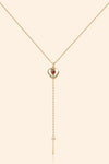 Gold heart charm necklace with removable arrow and red heart garnet center stone