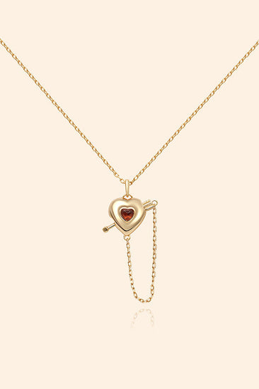 Gold heart charm necklace with removable arrow and red heart garnet center stone