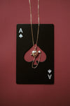 Gold heart charm necklace with removable arrow and red heart garnet center stone