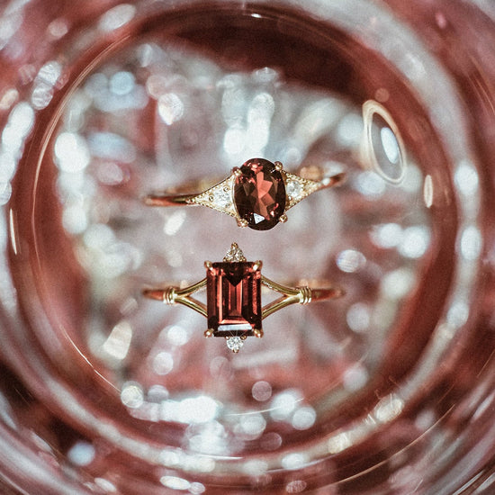 Dainty gold ring with emerald-cut garnet and sparkling moissanite accents