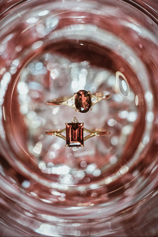 Dainty gold ring with emerald-cut garnet and sparkling moissanite accents